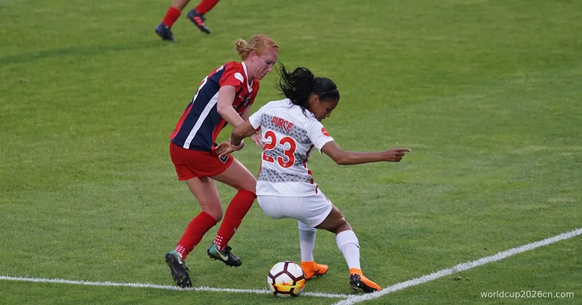 two women playing soccer on field
