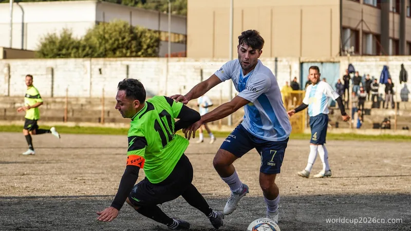 Two soccer players competing for the ball.