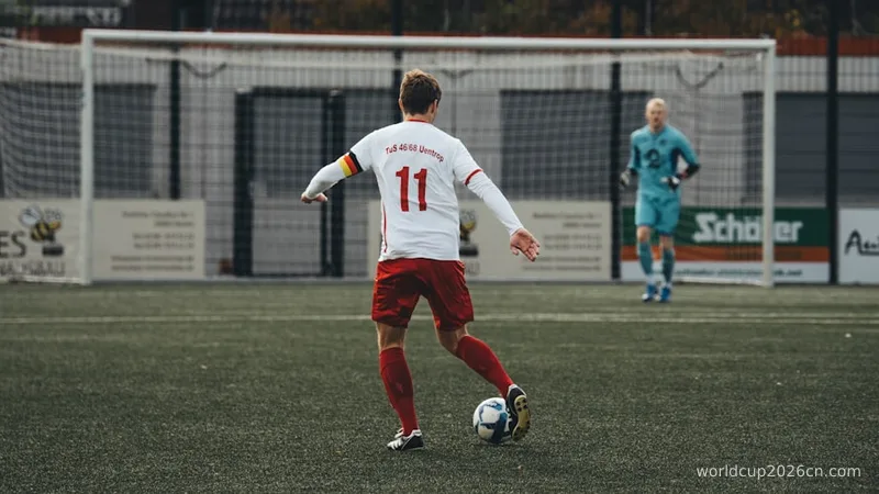 a man kicking a soccer ball on a field