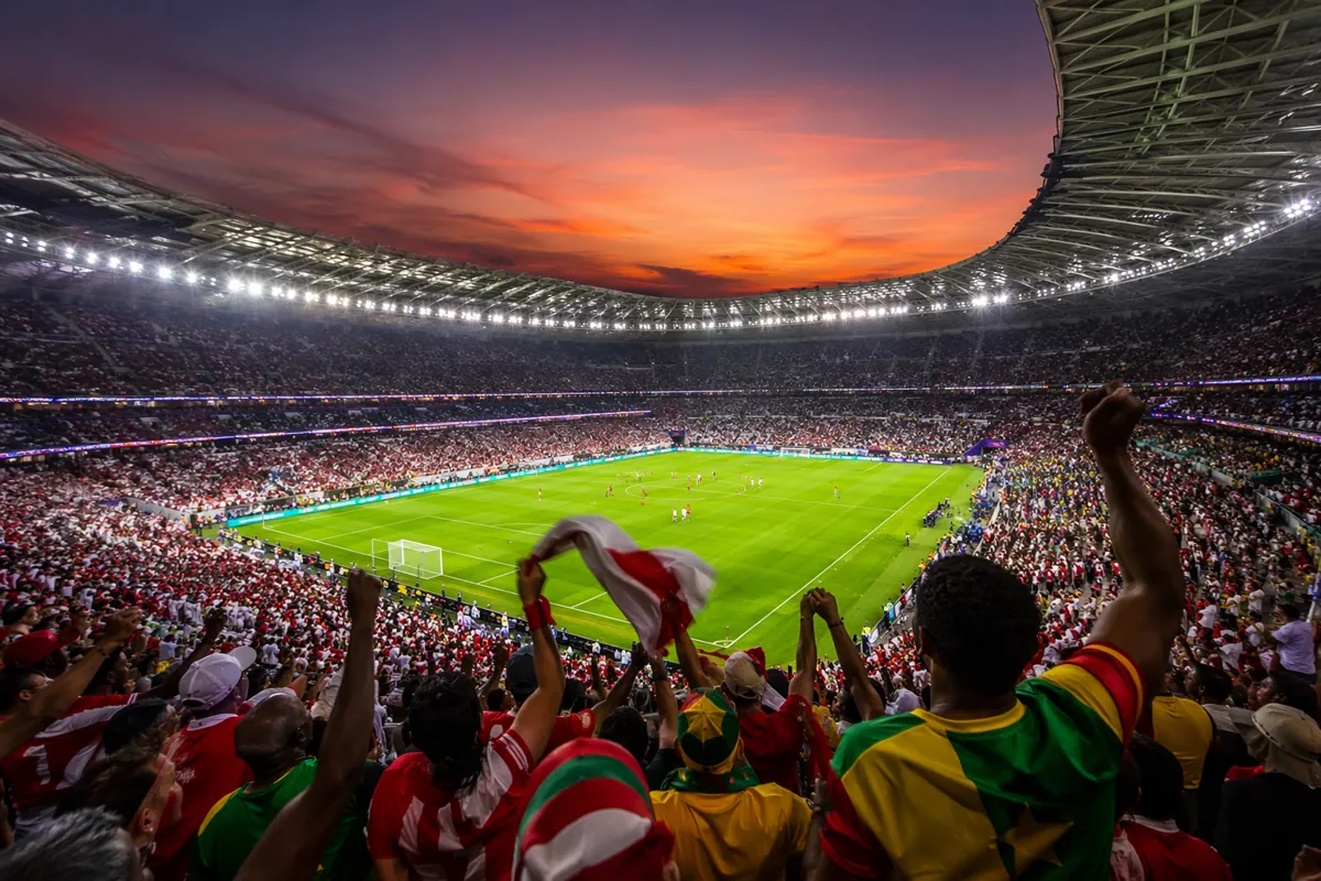Professional sports news header image, wide shot of a modern world cup football stadium at