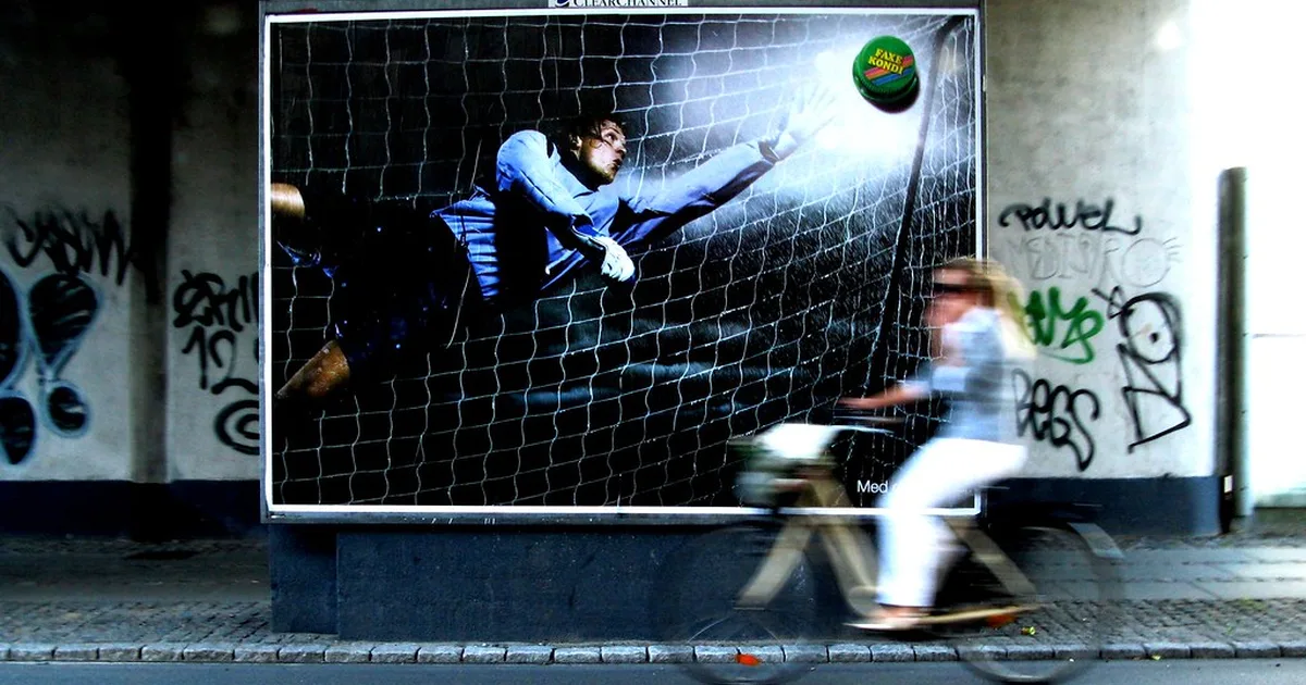 editorial news photo of a world cup football match, wide shot of green pitch with players
