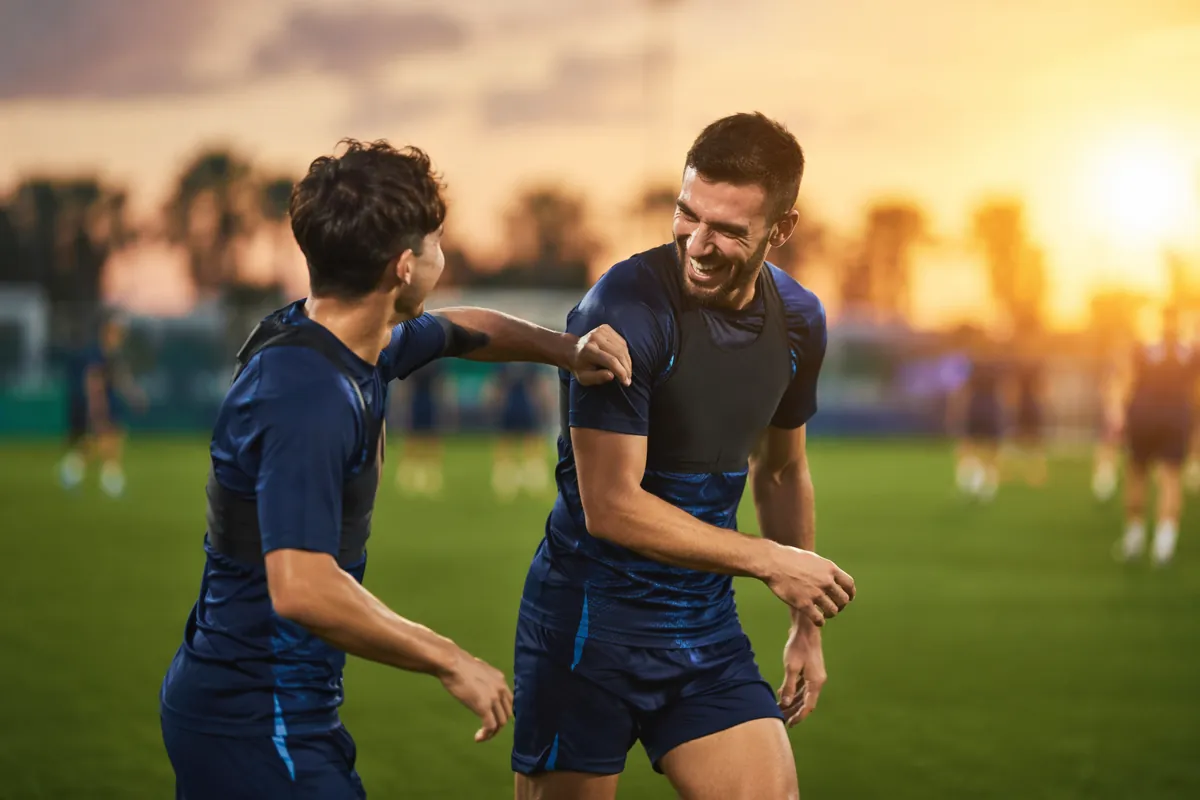 Professional sports news header image, blurred background of a World Cup training pitch wi