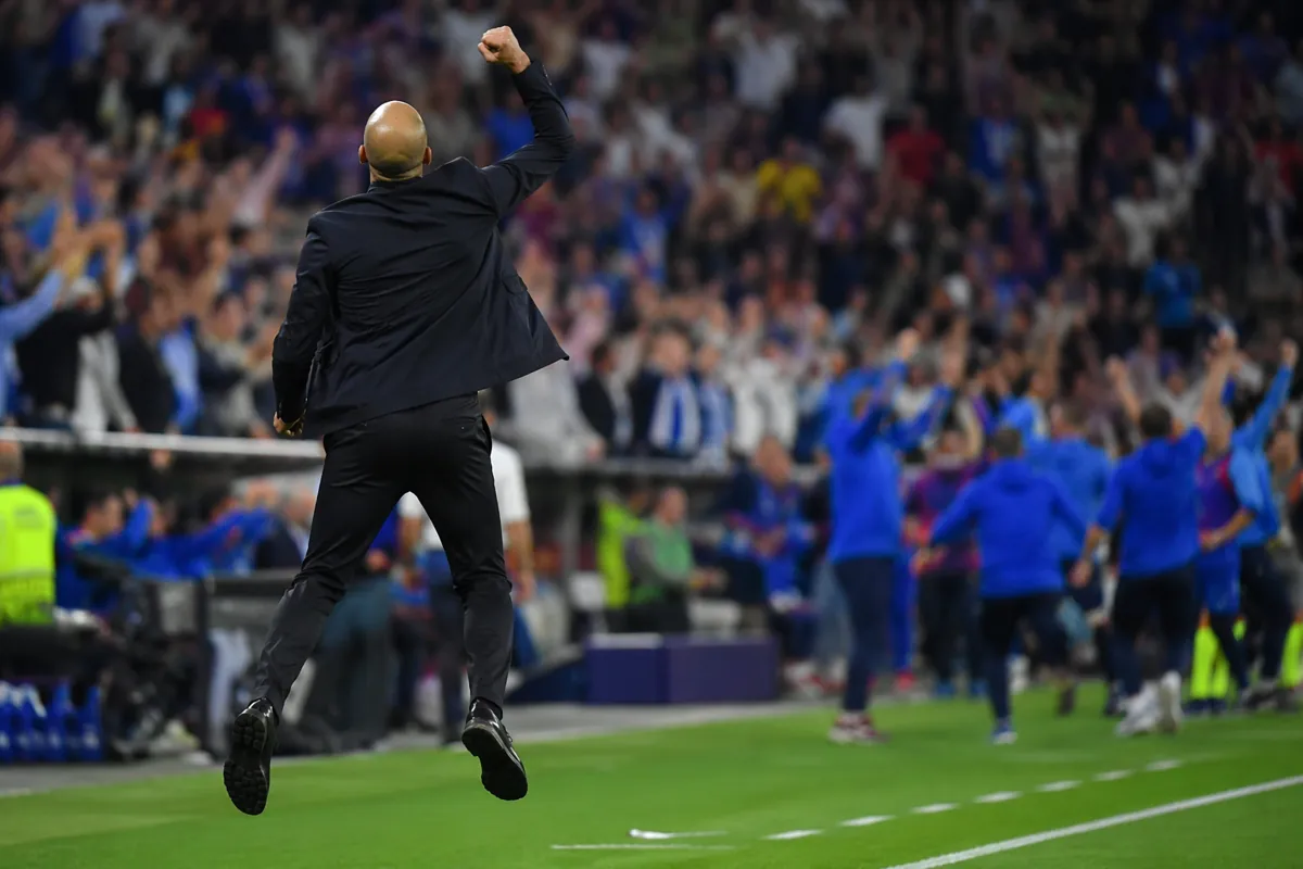 Professional sports photography of a football coach jumping high in excitement on the stad