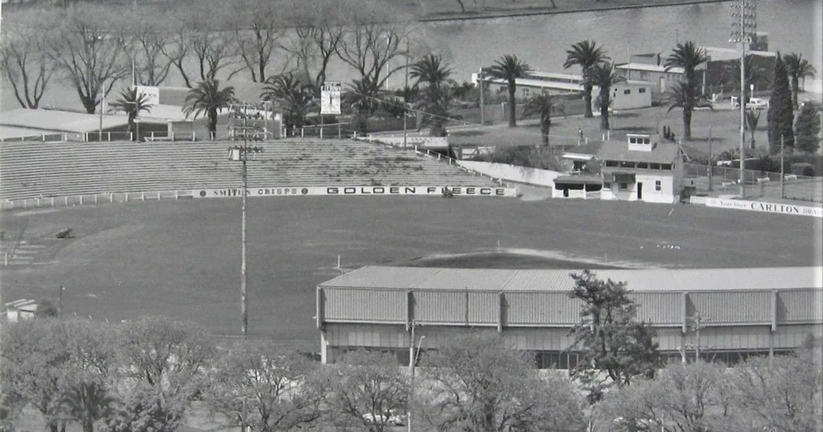 Vintage football stadium with worn classic football boots and a generic unbranded England-