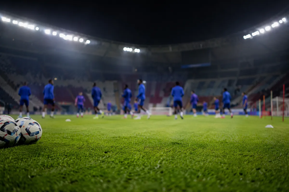 Editorial sports news header, blurred view of French national football team training groun