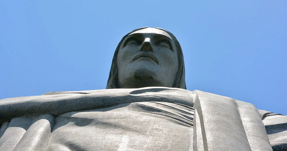 Panoramic view of Christ the Redeemer statue in Rio de Janeiro, Brazil, blue sky with soft