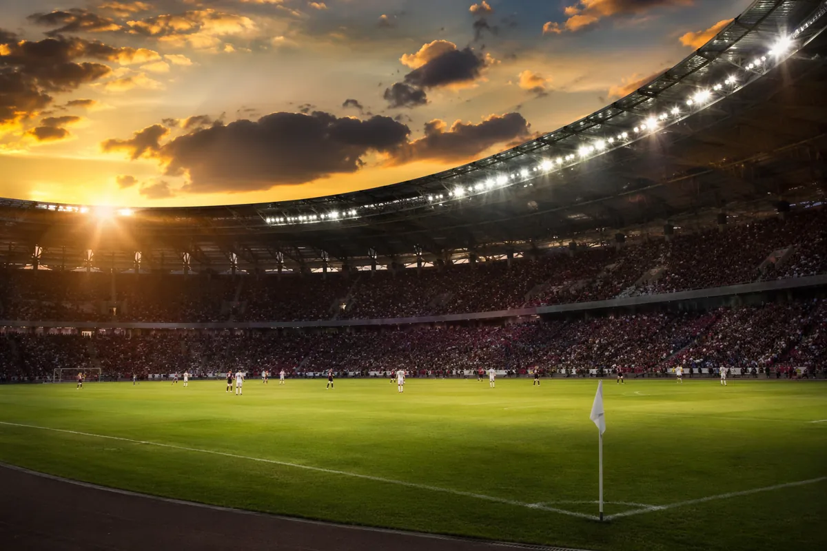 Professional editorial sports photography, wide shot of a generic soccer stadium during an