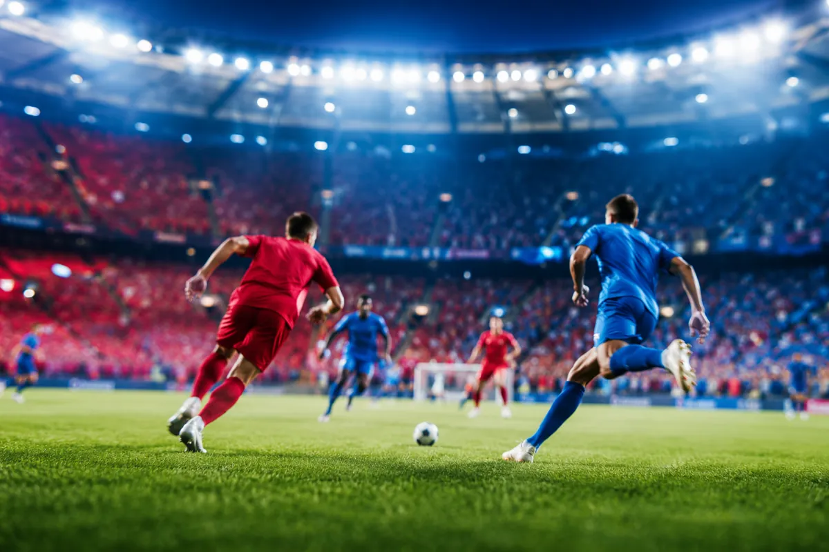 editorial sports news header image, vibrant world cup football match atmosphere, blurred f